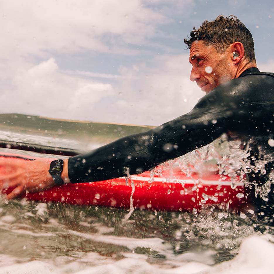 A person in a wet suit on a surfboard in the water

AI-generated content may be incorrect.